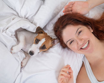 Portrait of young woman with dog