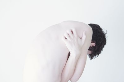 Close-up of young woman over white background