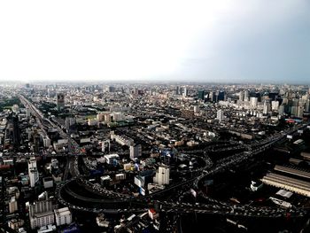 High angle view of city buildings against sky