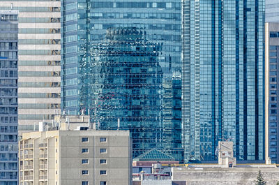 Reflection of buildings on glass window