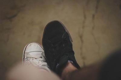 Person standing on tiled floor