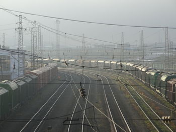 Train on railroad tracks against sky