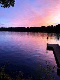 Scenic view of lake against romantic sky at sunset