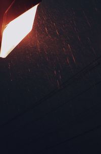 Low angle view of illuminated lamp