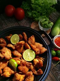 High angle view of fruits in plate on table