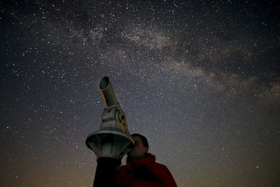 Low angle view of painting against sky at night