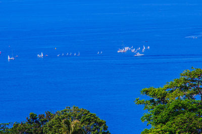 Scenic view of sea against blue sky