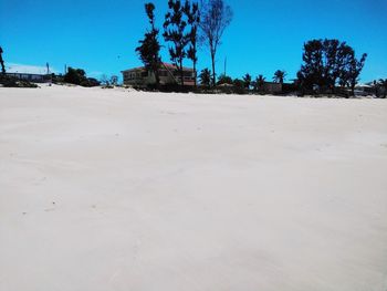 Scenic view of land against clear blue sky