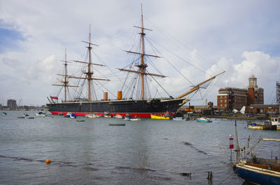 Hms warrior moored on the jetty at portsmouth dockyard