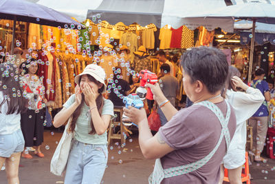 People photographing in city