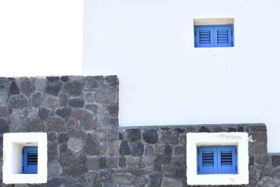 Low angle view of window on wall of building