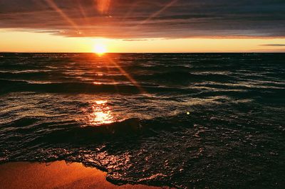 Scenic view of sea against sky at sunset