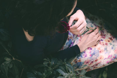 High angle view of woman using mobile phone outdoors