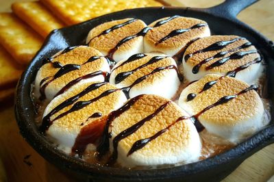 Close-up of marshmallow with chocolate sauce in bowl