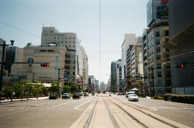 Road in city against sky