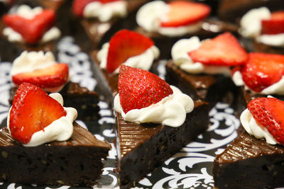 Close-up of chocolate cake with strawberries on the top