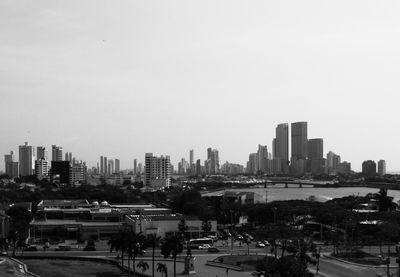 High angle view of buildings in city against clear sky