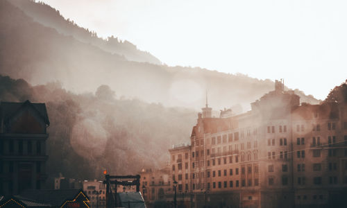 Buildings in city against sky