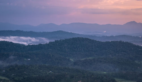 Scenic view of mountains against sky during sunset