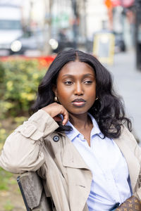 Portrait of young woman looking away