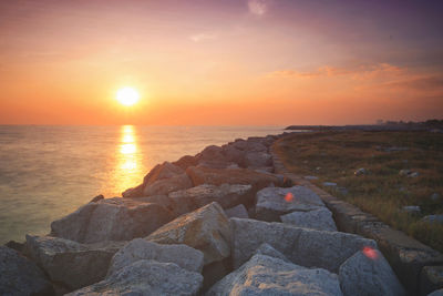 Scenic view of sea against sky during sunset
