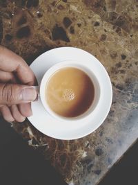 High angle view of coffee cup on table