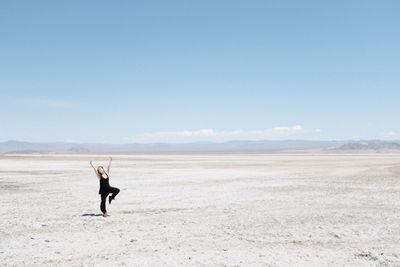 Full length of a woman walking in desert