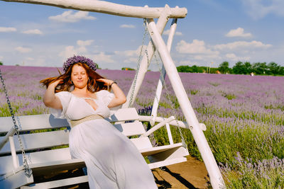 Young woman sitting on slide