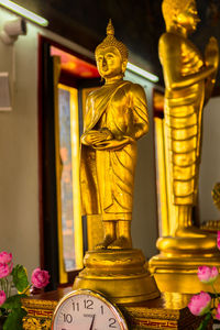 Buddha statue in temple outside building