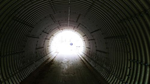 Low angle view of illuminated lights in tunnel