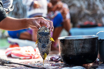 Midsection of woman holding food