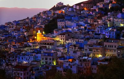 High angle view of illuminated buildings in city