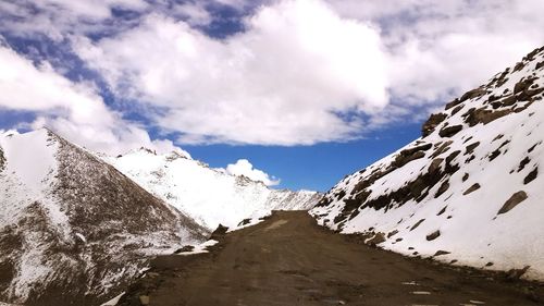 View of road against cloudy sky