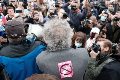 Rear view of people photographing