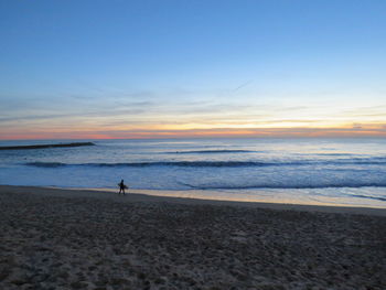 Scenic view of sea at sunset