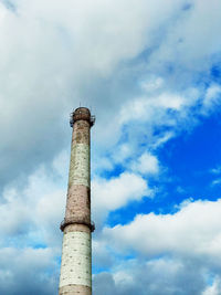 Low angle view of smoke stack against sky