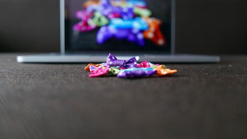 Close-up of colorful tied bows on table