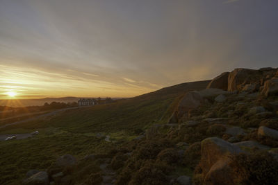 Scenic view of landscape against sky during sunrise