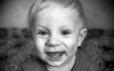 Portrait of cute smiling baby boy at home