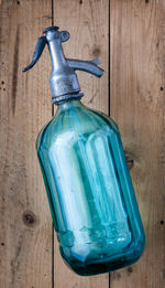 Close-up of bottle against blue background