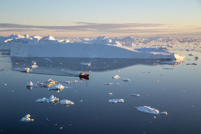 Scenic view of sea against sky during winter