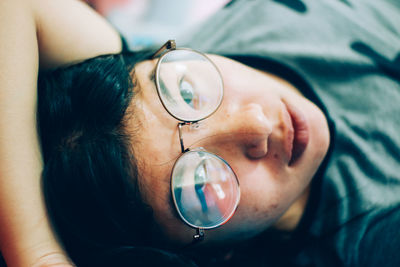 Close-up portrait of woman wearing eyeglasses