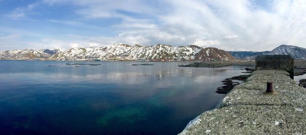 Panoramic view of lake and snowcapped mountains against sky