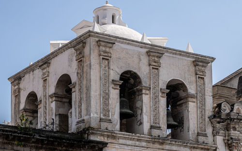 Low angle view of statue against sky
