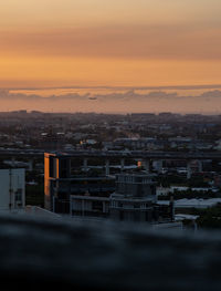 Cityscape against sky during sunset