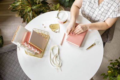 High angle view of woman sitting on table