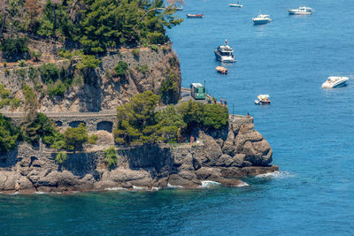 View of green lush hills and cliffs of portofino town area, ligurian seaside, italy