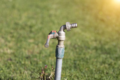 Low angle view of pipe on field