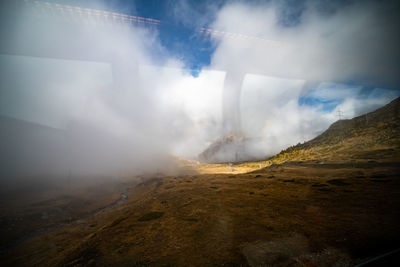 Scenic view of volcanic mountain against sky