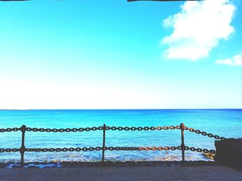 Scenic view of sea against blue sky